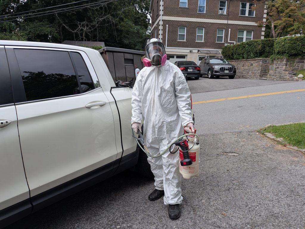 Licensed pest control technician arriving for inspection in Westchester County